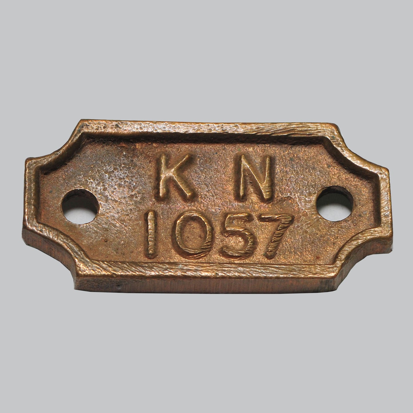 Vintage Number Tag — "KN 1057," Origin Unconfirmed